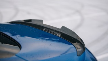 Carbon spoiler on the trunk of modern supercar