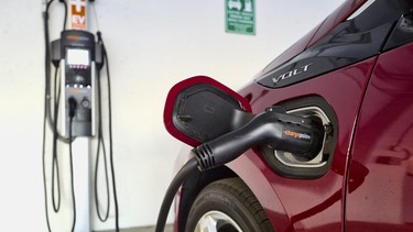 An electric vehicle plugged into an EV charger in California