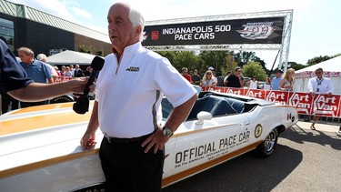 Roger Penske is interviewed before a dream cruise event by Penske drivers in 16 pace cars, which represented the 16 Indianapolis 500 victories for Penske drivers on Woodward Avenue in Royal Oak on Thursday, August 13, 2015.