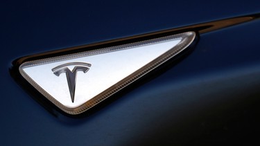 The badge on a Tesla Model S sedan