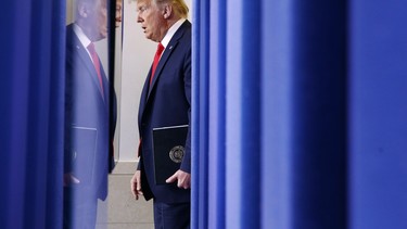 President Donald Trump arrives for a coronavirus task force briefing at the White House, Sunday, March 22, 2020, in Washington.