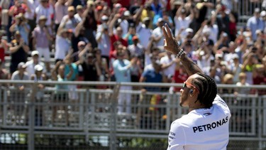 Mercedes driver Lewis Hamilton waves to the crowd during the drivers' parade at the Canadian Grand Prix in Montreal on June 9, 2019.