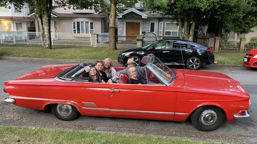 Ian Waddell takes his neighbours for a ride in the 'Red Shark'.