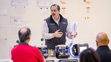 Joe Cipollone, Ventec's VP of entineering, explains how its VOCSN ventilators work to GM employees.