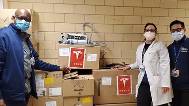 Staff with NYC Health + Hospitals pose with donated BiPAP machines sent by Tesla's Elon Musk.