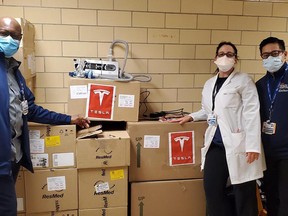 Staff with NYC Health + Hospitals pose with donated BiPAP machines sent by Tesla's Elon Musk.