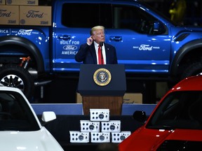 US President Donald Trump gestures as he speaks during a tour at the Ford Rawsonville Plant that has been converted to making personal protection and medical equipment in Ypsilanti, Michigan on May 21, 2020.