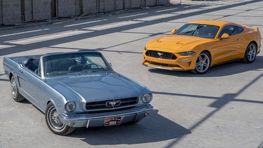 A 2018 and a 1965 Ford Mustang