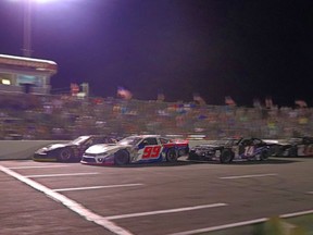 Short-track cars race on a speedway in North Carolina