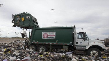 A city garbage truck unloads 10 tonnes of garbage at the city landfill on Manning Drive in London, Ont. on Thursday April 16, 2015.  Craig Glover/The London Free Press/Postmedia Network