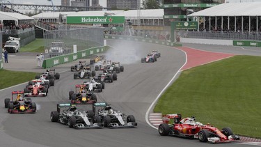 Formula One cars take the first turn at the start of the Canadian Grand Prix at Circuit Gilles-Villeneuve in Montreal on Sunday, June 12, 2016.