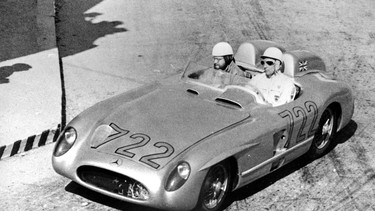 Sir Stirling Moss driving the Mercedes-Benz 300 SLR in the 1955 Mille Miglia, pictured here in Brescia, Italy