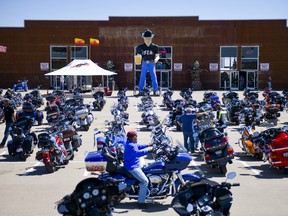 A motorcycle rider looks for parking outside the Full Throttle Saloon during the 80th Annual Sturgis Motorcycle Rally in Sturgis, South Dakota on August 9, 2020.