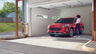 An EV charger in a home garage