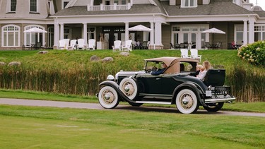 Rob and Rosemary McLeese and grandchildren ride in their restored 1931 McLaughlin-Buick sport roadster at the Cobble Beach Resort Community