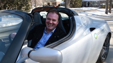 Sun Country Highway president Kent Rathwell at the wheel of his Tesla Roadster.