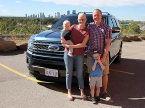 Wayne and Janelle De Boer with their children in front of the 2020 Ford Expedition.