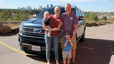 Wayne and Janelle De Boer with their children in front of the 2020 Ford Expedition.