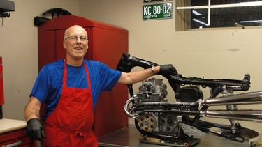 Dennis Firth of Calgary in his basement workshop with his 1973 Honda CL350 project.