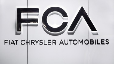 In this Monday, Jan. 14, 2019 file photo, Fiat Chrysler Automobiles FCA logo is shown at the North American International Auto Show in Detroit.