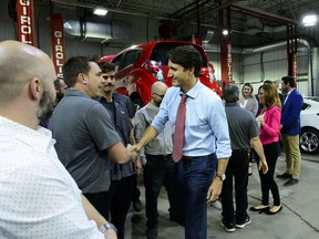 Justin Trudeau makes a policy announcement at an electric vehicle car dealership during a campaign stop in Trois-Rivieres, Quebec