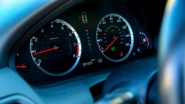 Close-up view of speedometers and other gauges on a passenger car