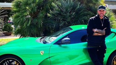 Fashion designer Phillipp Plein with his Ferrari 812