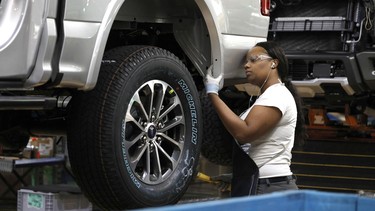 A Ford Motor Company worker works on a Ford F-150 truck on the assembly line at the Ford Dearborn Truck Plant on September 27, 2018 in Dearborn, Michigan.