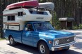 One of Chuck Young's trucks is this 1971 Chevrolet C10, seen here loaded with their original 1983 Vanguard camper and canoes.