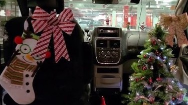 Forest Atkinson, 31, has been driving an Uber for the past month, decorated in Christmas garb to lift spirits of her passengers.