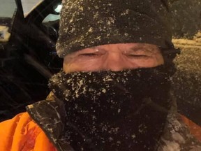 Man Clears snow for healthcare workers