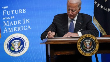 U.S. President Joe Biden signs an executive order related to American manufacturing in the South Court Auditorium of the White House complex on January 25, 2021 in Washington, DC.