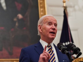 US President Joe Biden speaks about the Covid-19 response before signing executive orders for economic relief to Covid-hit families and businesses in the State Dining Room of the White House in Washington, DC, on January 22, 2021.