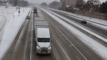 Traffic moves through Sarnia on Highway 402 Sunday (December 2019). Environment Canada said reduced visibility caused by snow squalls was making travel hazardous in the region. It issued both a snow squall and extreme cold warning Sunday for Sarnia and Lambton County.
