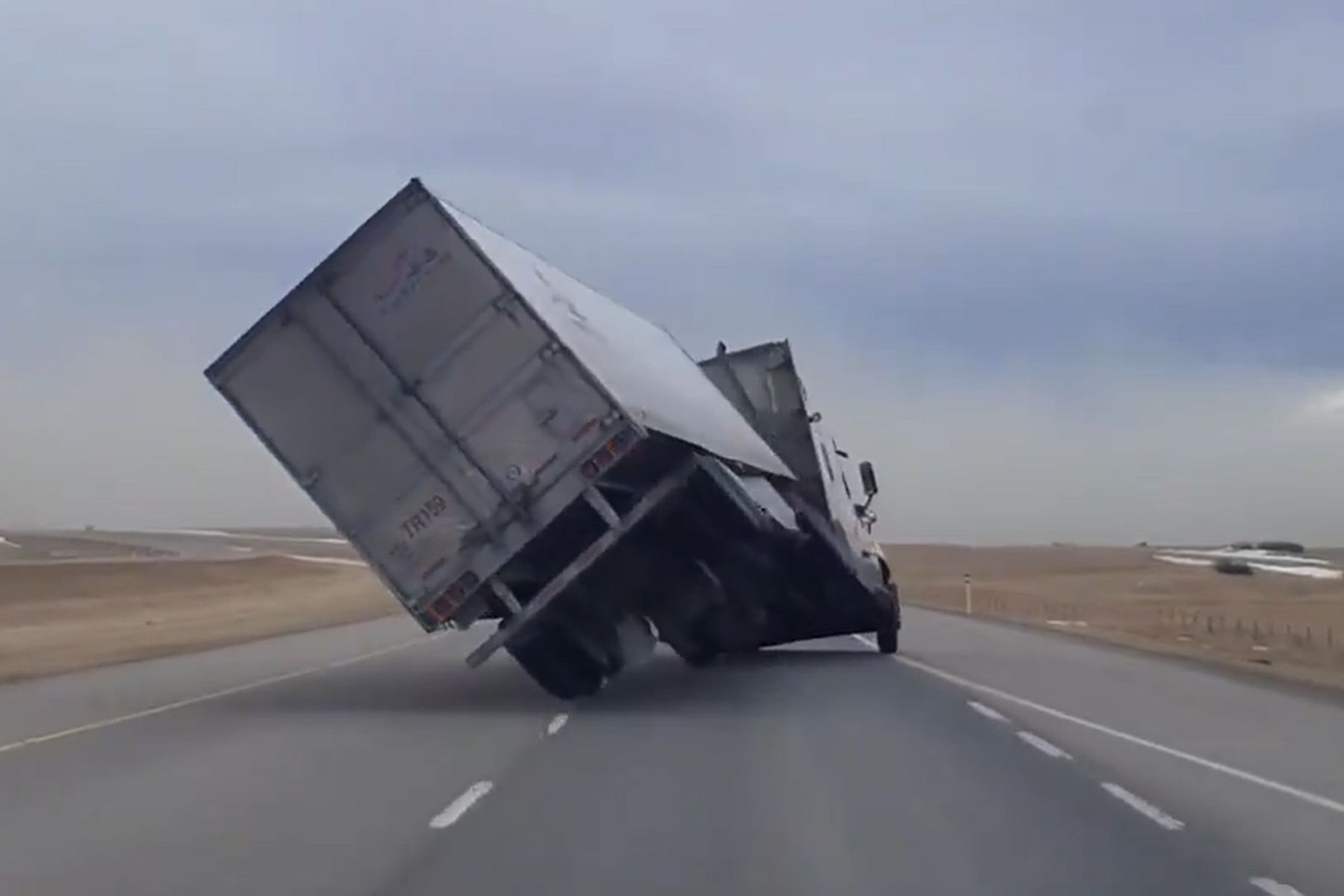 Watch High winds in Alberta wreak havok, tip over semi truck Driving
