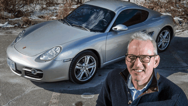 Jonathan Kay with the Porsche Cayman he recently invested in.
