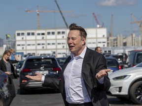 Tesla head Elon Musk talks to the press as he arrives to to have a look at the construction site of the new Tesla Gigafactory near Berlin on September 03, 2020 near Gruenheide, Germany.