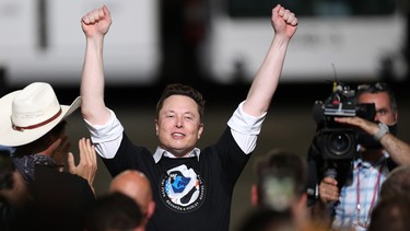 Spacex founder Elon Musk celebrates after the successful launch of the SpaceX Falcon 9 rocket with the manned Crew Dragon spacecraft at the Kennedy Space Center on May 30, 2020 in Cape Canaveral, Florida.