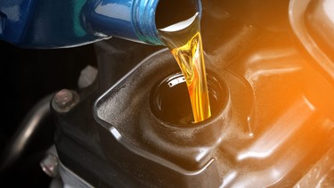 Refueling and pouring oil into the engine motor car Transmission and Maintenance Gear oil change