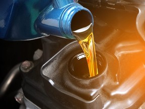 Refueling and pouring oil into the engine motor car Transmission and Maintenance Gear oil change