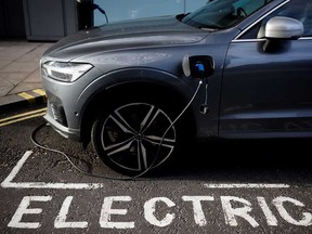 An electric Volvo parked in an EV charging spot.