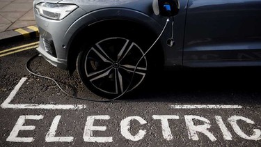 An electric Volvo parked in an EV charging spot.