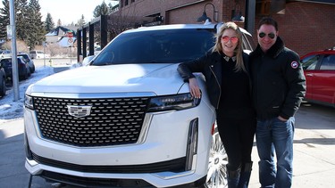 Mike Kwiatkowski and his fiance Haley McLean with their beloved 2021 Cadillac Escalade.