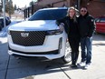 Mike Kwiatkowski and his fiance Haley McLean with their beloved 2021 Cadillac Escalade.