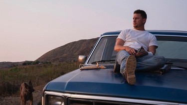 Channing Tatum sits on the hood of a Ford pickup
