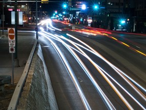 A long exposure shows the blurred lights of vehicles as they travel along Broad Street in Regina, Saskatchewan on May 2, 2020.