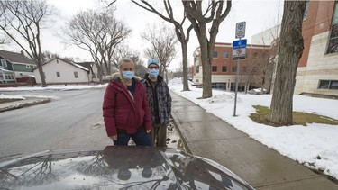 LPN Chantelle Dolney, left, and LPN Adam Swalm stand near a ticketed vehicle near the Regina General Hospital in Regina on Thursday, April 15, 2021. Both nurses are frustrated with two-hour parking limits around the hospital and feel further accommodation should be offered to hospital staff during the pandemic.