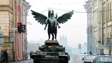 A still from "GoldenEye" of a tank driving through a Russian city.