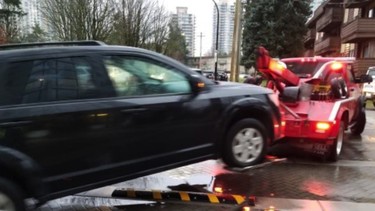 An illegal ride-hailing vehicle is towed by Burnaby RCMP.