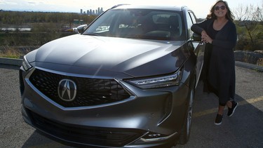 Rosa Reyes poses with the 2022 Acura MDX.